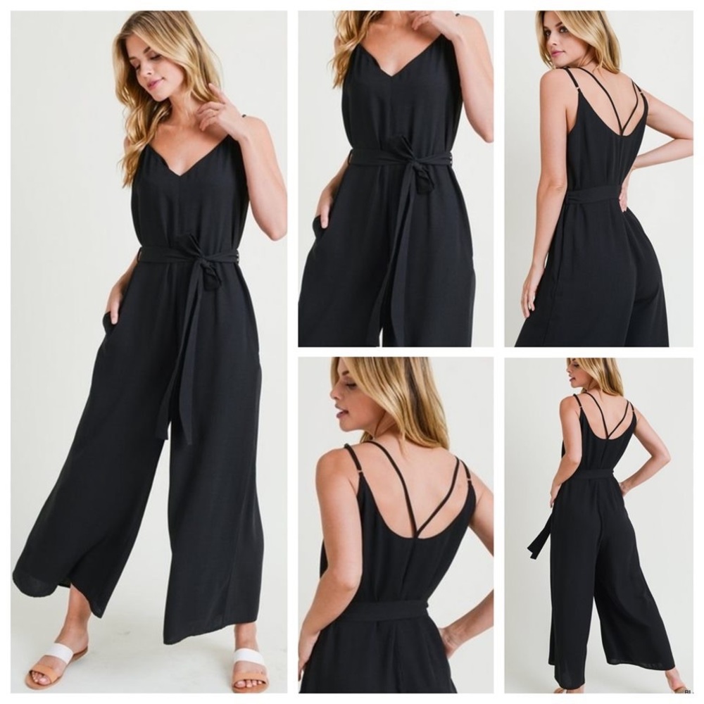 Wide leg crop, surplice cut jumpsuit in black.
